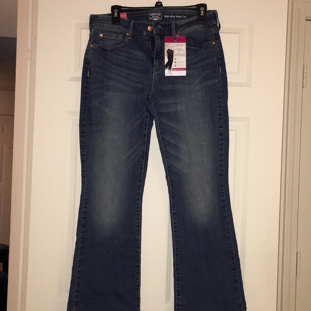Women’s mid rise boot cut jean